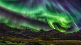 Mountains under Aurora Borealis